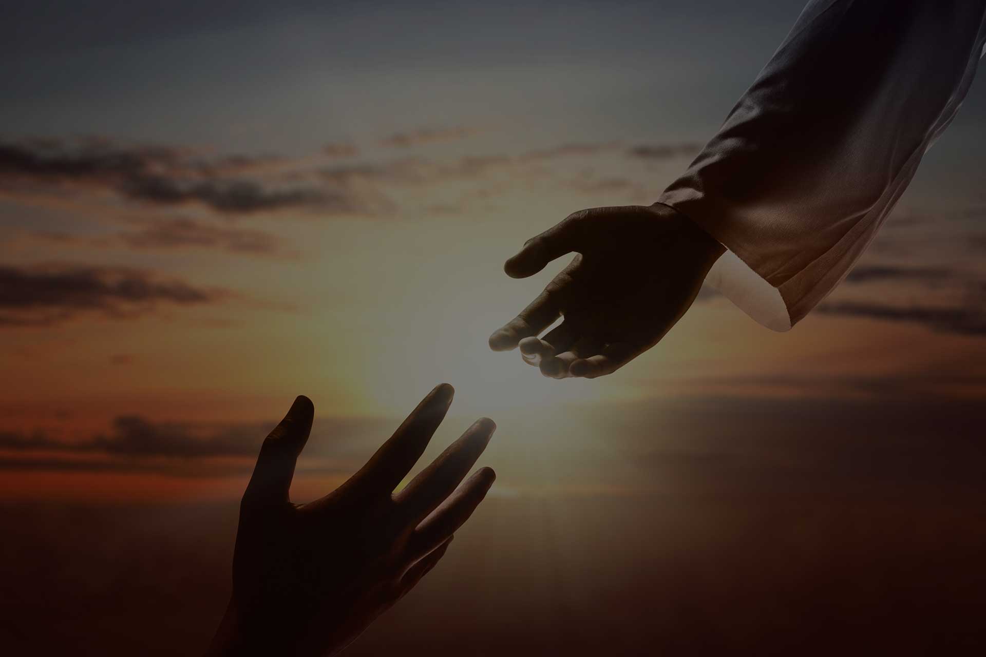 hands-reaching-darkened